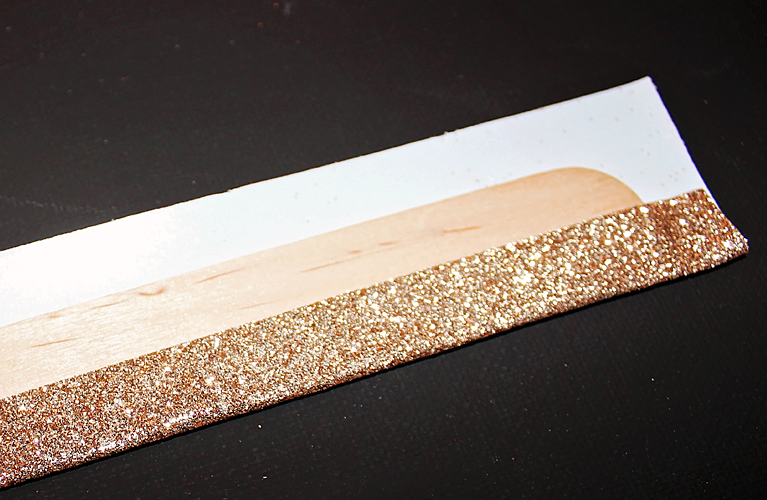 Carefully wrap the glitter tape around the popsicle stick to create a glittered handle | Alex Inspired