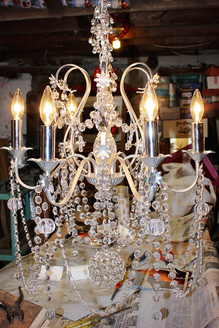 Refurbished Chandelier | Alex Inspired – Old brass chandelier is given new life with spray paint, Christmas crystal, new wiring and extra bling.