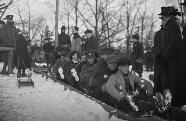 One Hundred Christmases Ago -Toboggan on slides with soldiers and civilians, in High Park [Toronto, Ont.], 19 February, 1916