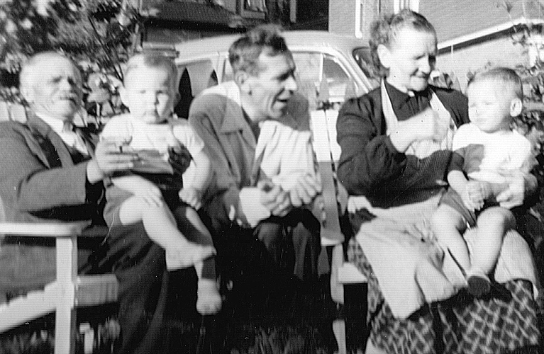 Antoni Frankow with his twin grandsons, Peter and Paul, along with his son and wife, outside on court street